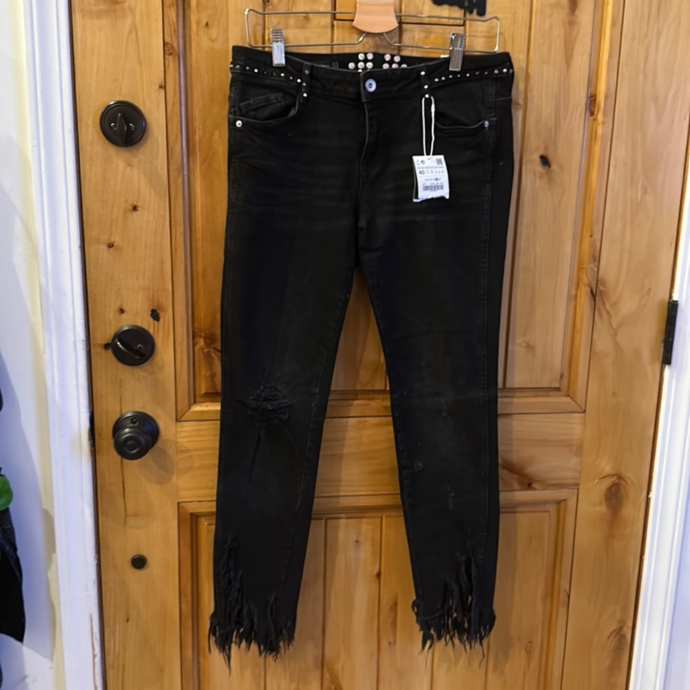 Zara denim jeans. Studs around the belt area. Raw hem.